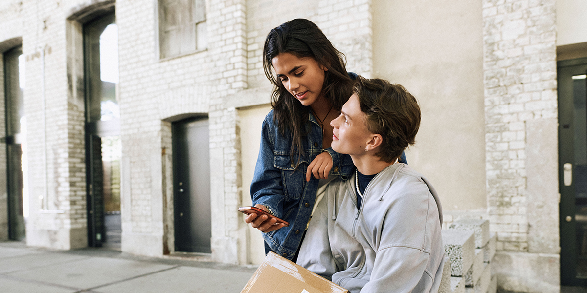 Teenagers with parcel